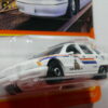 COCHE DE POLICIA NUEVO A ESCALA APROXIMADA 1/64. VISTA FRONTAL.