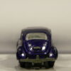 COCHE DE SEGUNDA MANO CON SEÑALES DE USO A ESCALA APROX. 1/64. VISTA TRASERA.