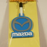 LLAVERO NUEVO DE GOMA Y METAL MARCA MAZDA.