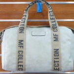 BOLSA DE PIEL SINTETICA APTA PARA VIAJE TAMAÑO PEQUEÑO.