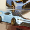 COCHE DEPORTIVO NUEVO A ESCALA APROXIMADA 1/64. VISTA FRONTAL.