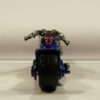 MOTO CHOPPER DE SEGUNDA MANO CON ALGUNAS SEÑALES DE USO Y BUEN ESTADO GENERAL SIN BLISTER A ESCALA APROXIMADA 1/64. VISTA TRASERA.