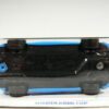 DEPORTIVO DESCAPOTABLE COUPE DE COMPETICION NUEVO EN MINIATURA A ESCALA APROXIMADA 1/64. VISTA INFERIOR.