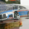 COCHE PATRULLA NUEVO EN MINIATURA A ESCALA APROXIMADA 1/64. VISTA FRONTAL.